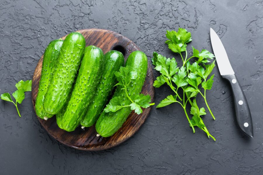 Cucumbers. Fresh cucumbers on wooden board