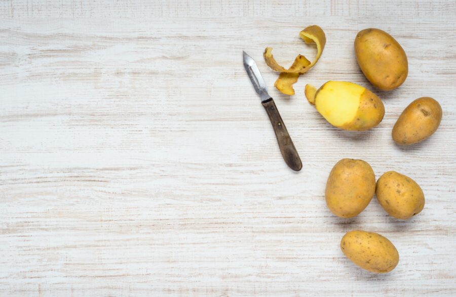 Potatoes and Peeled Potato on Copy space