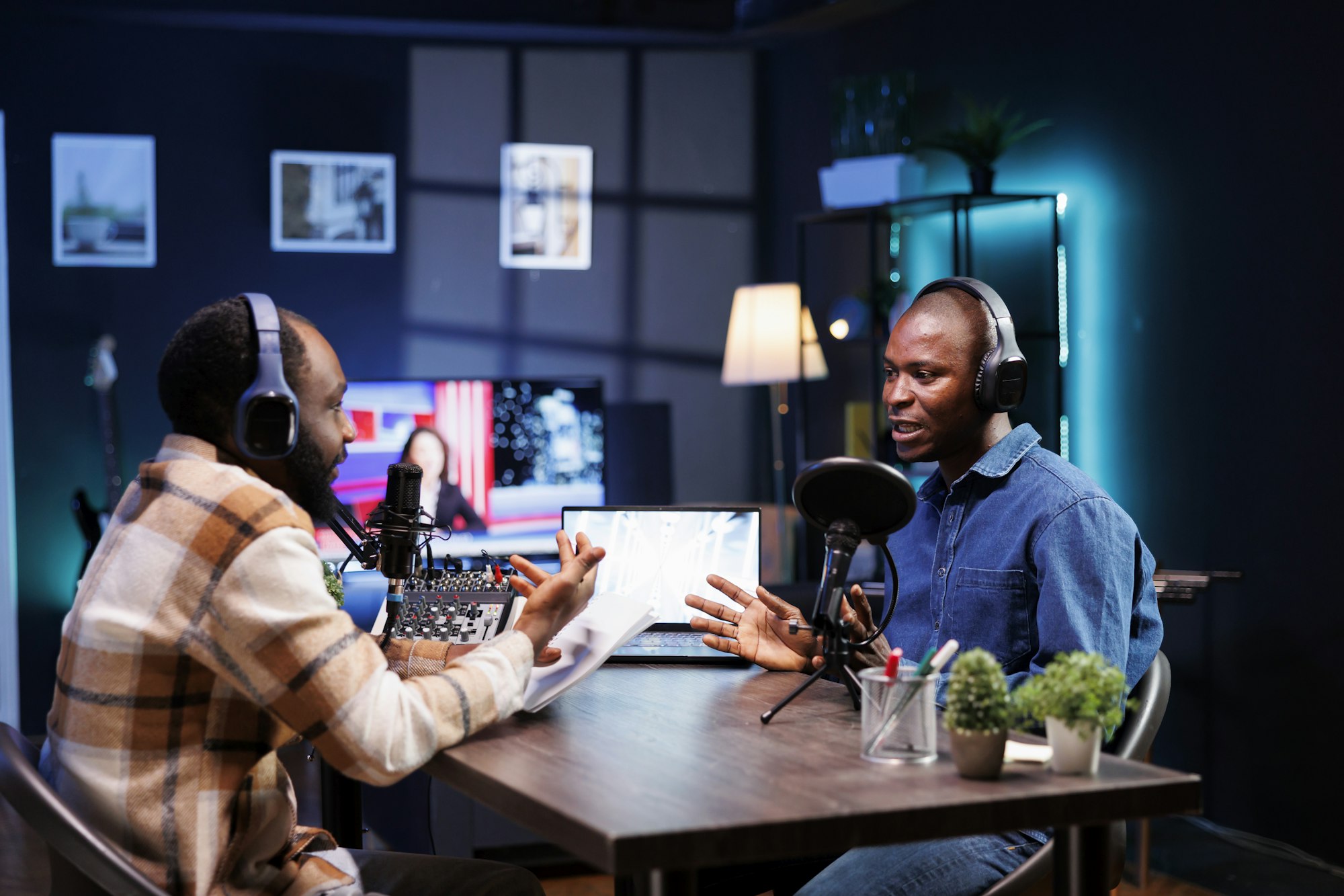 Black men recording a talk show at home