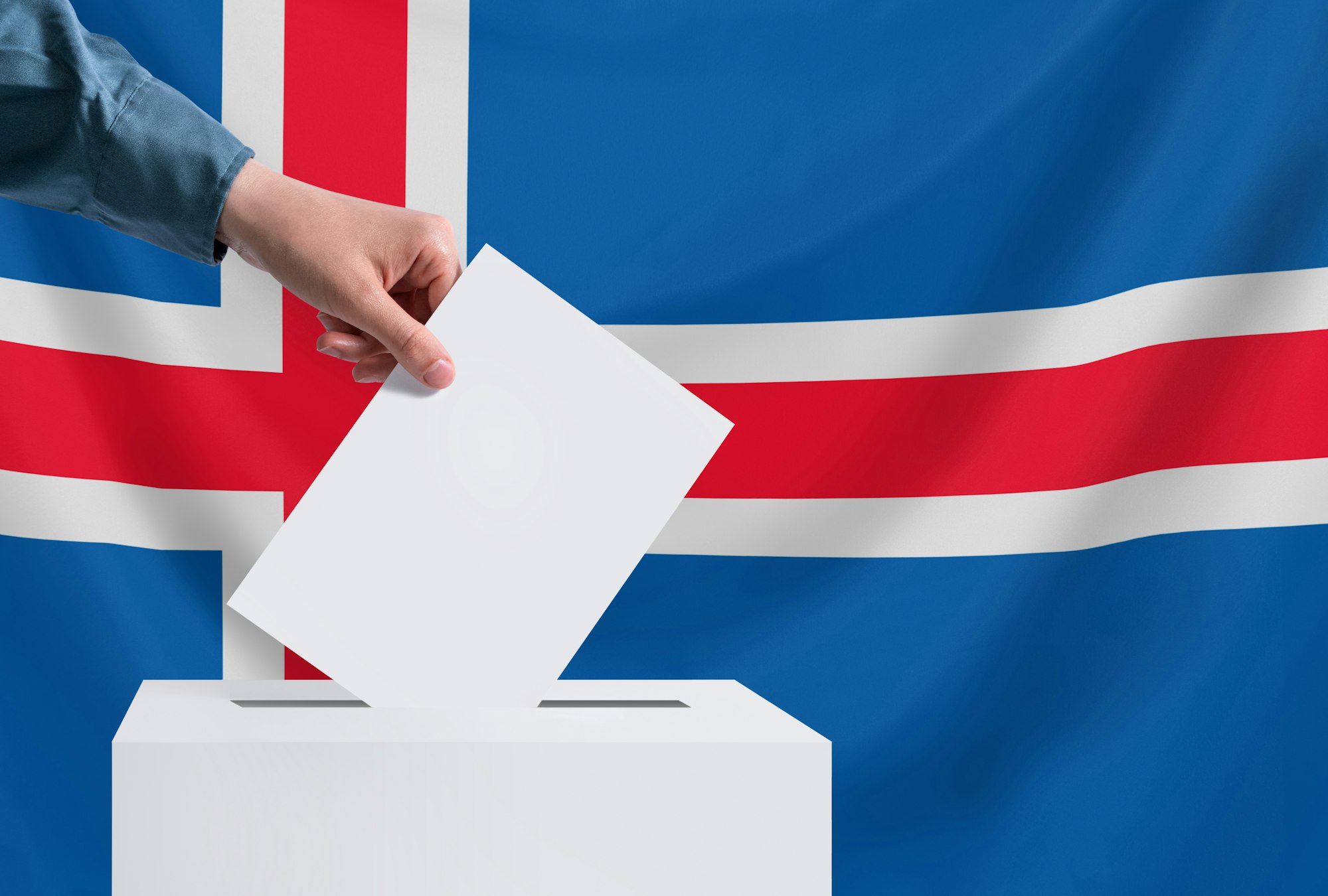 Elections, Iceland. Election concept. The voter throws the ballot into the box. Copy space