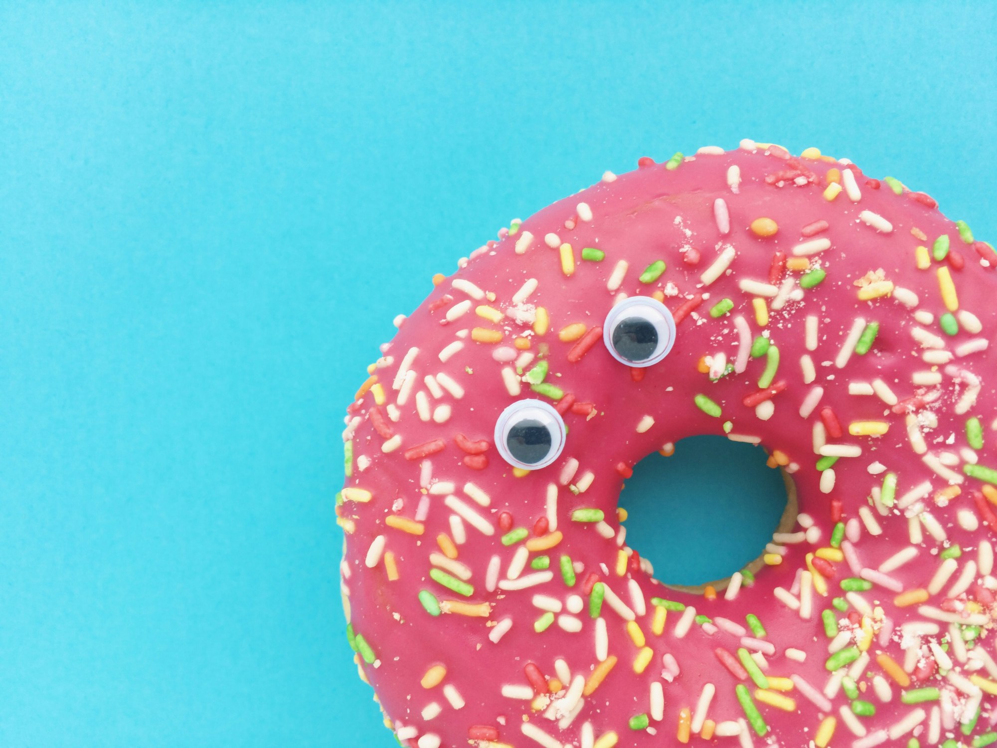 Funny shock face donut on a blue background