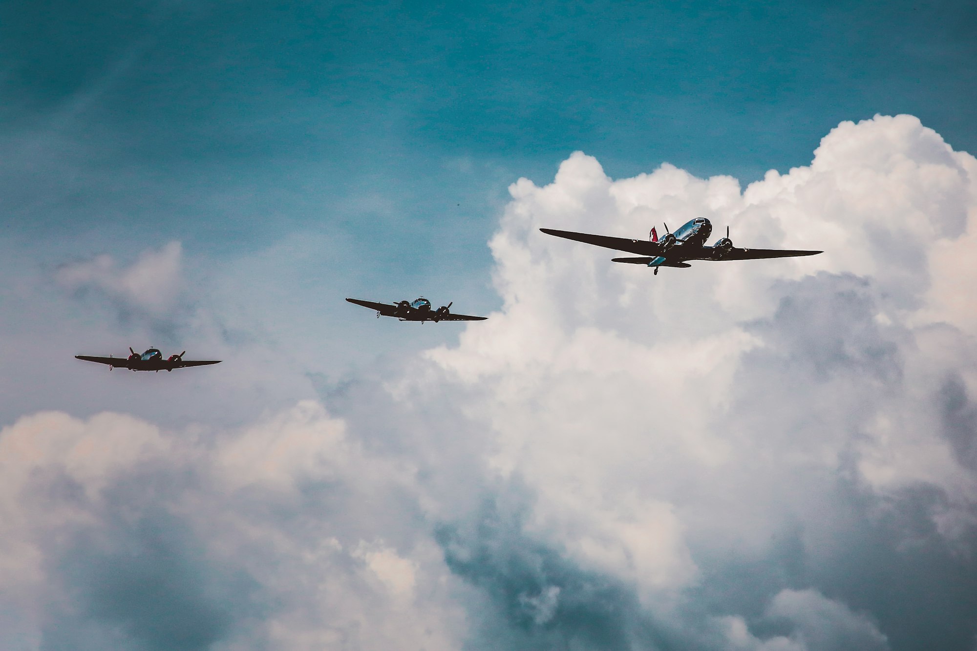 Low angle shot of a range of aircraft preparing an air show under the breathtaking cloudy sky