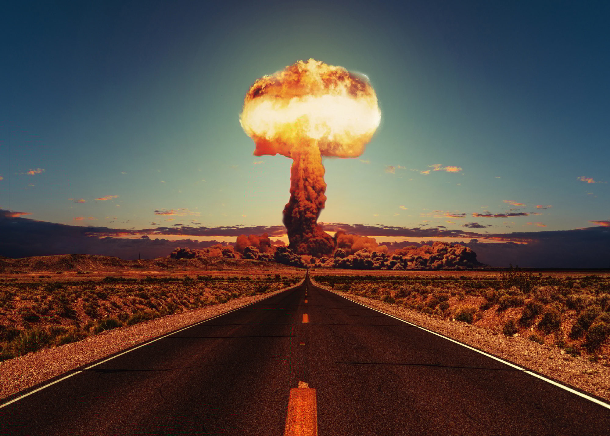 Asphalt road goes to a nuclear explosion. Terrible atomic explosion of a nuclear bomb