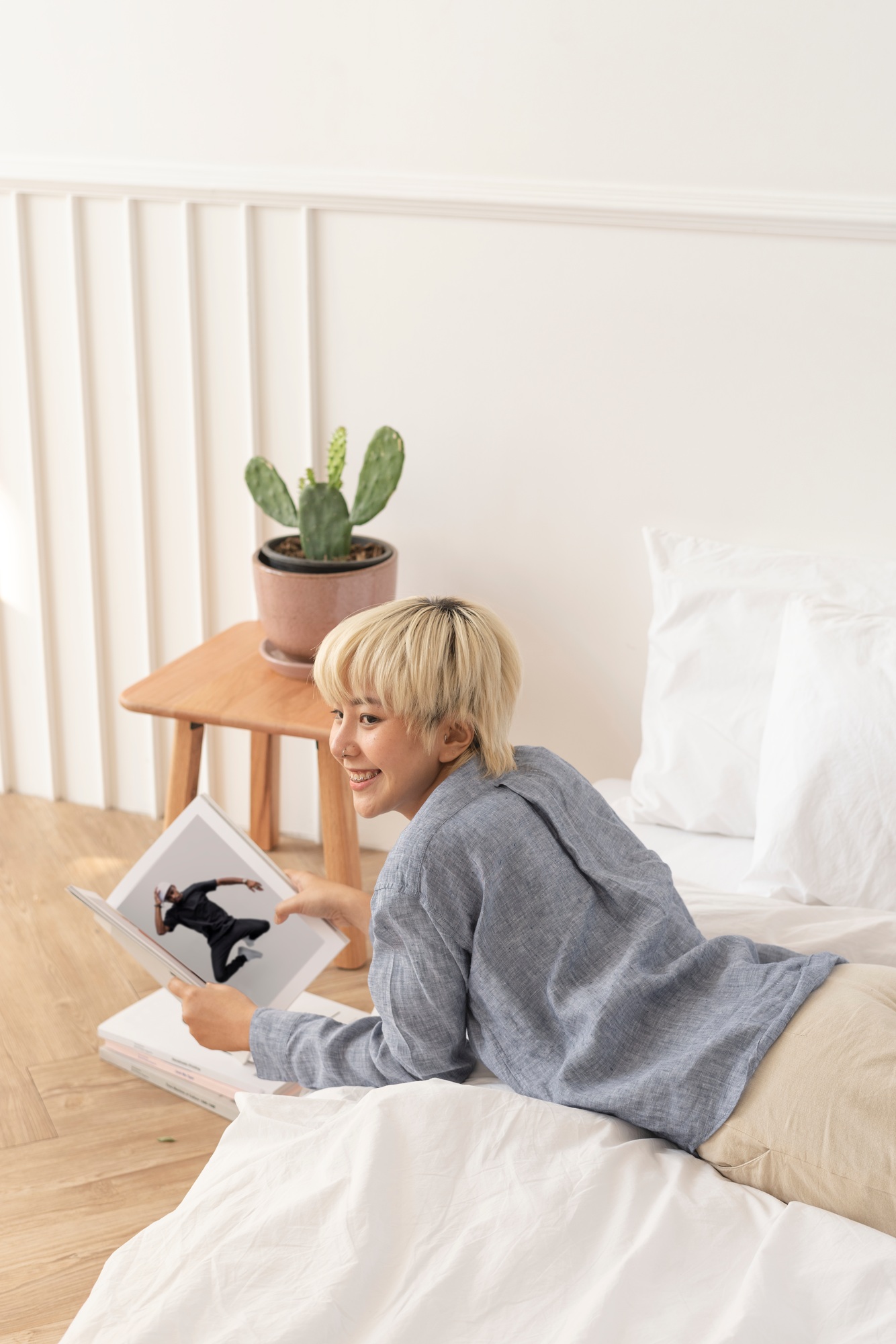 Asian woman reading a magazine in the bed