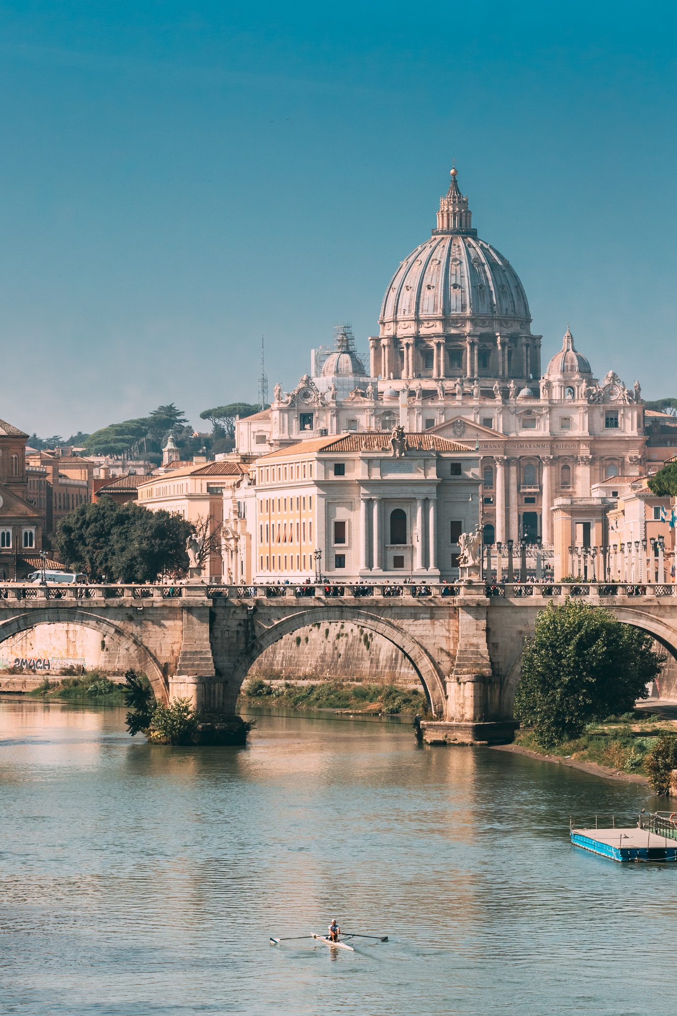 Rome, Italy. Man Training On Kayak Near Aelian Bridge. Papal Basilica Of St. Peter In The Vatican